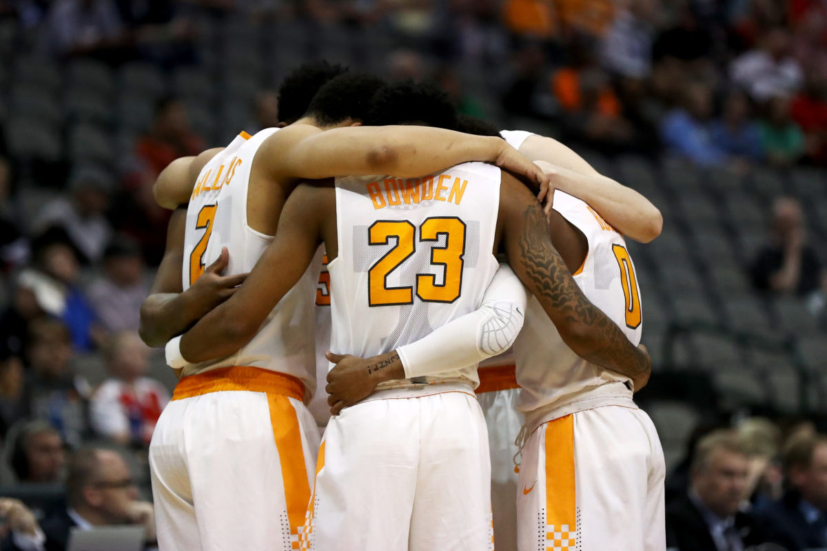 Tennessee basketball players huddle during NCAA Tournament game.