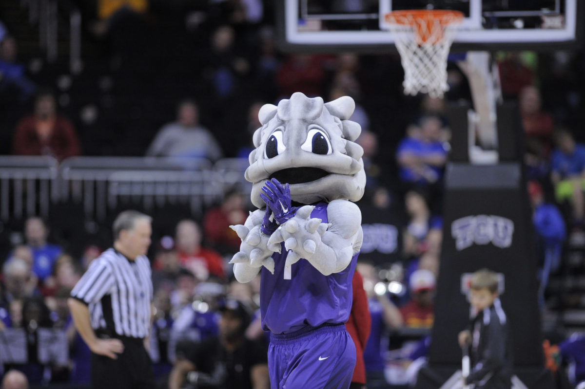 The TCU Horned Frogs' mascot entertains during a game Texas Tech Red Raiders in the first round of the Big 12 Basketball Tournament at Sprint Center.