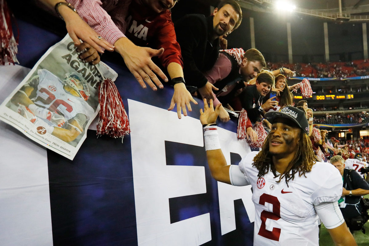 Jalen Hurts of the Alabama Crimson Tide celebrates their 54 to 16 win over the Florida Gators in the SEC Championship game.