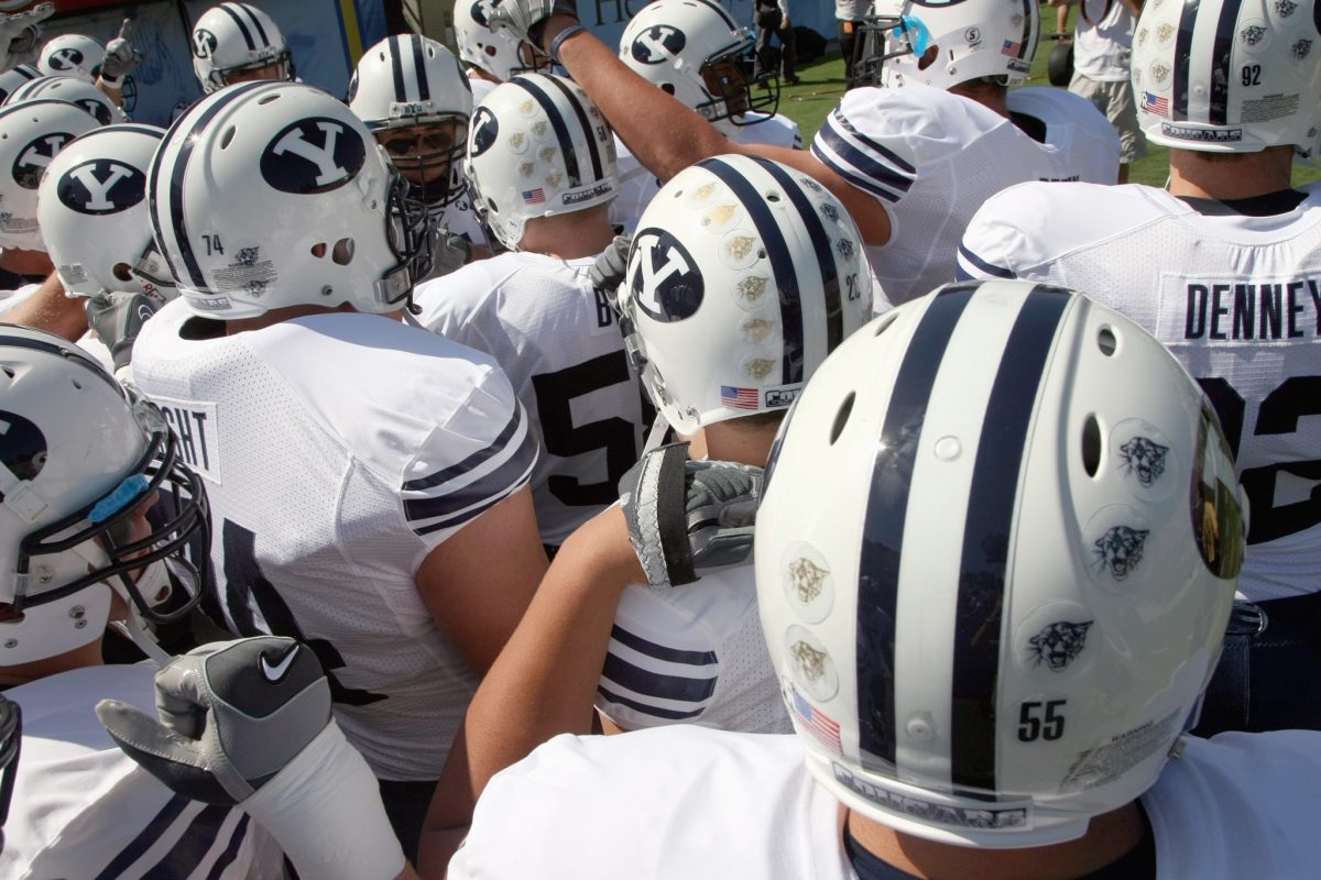 The BYU football team huddled up before a game.