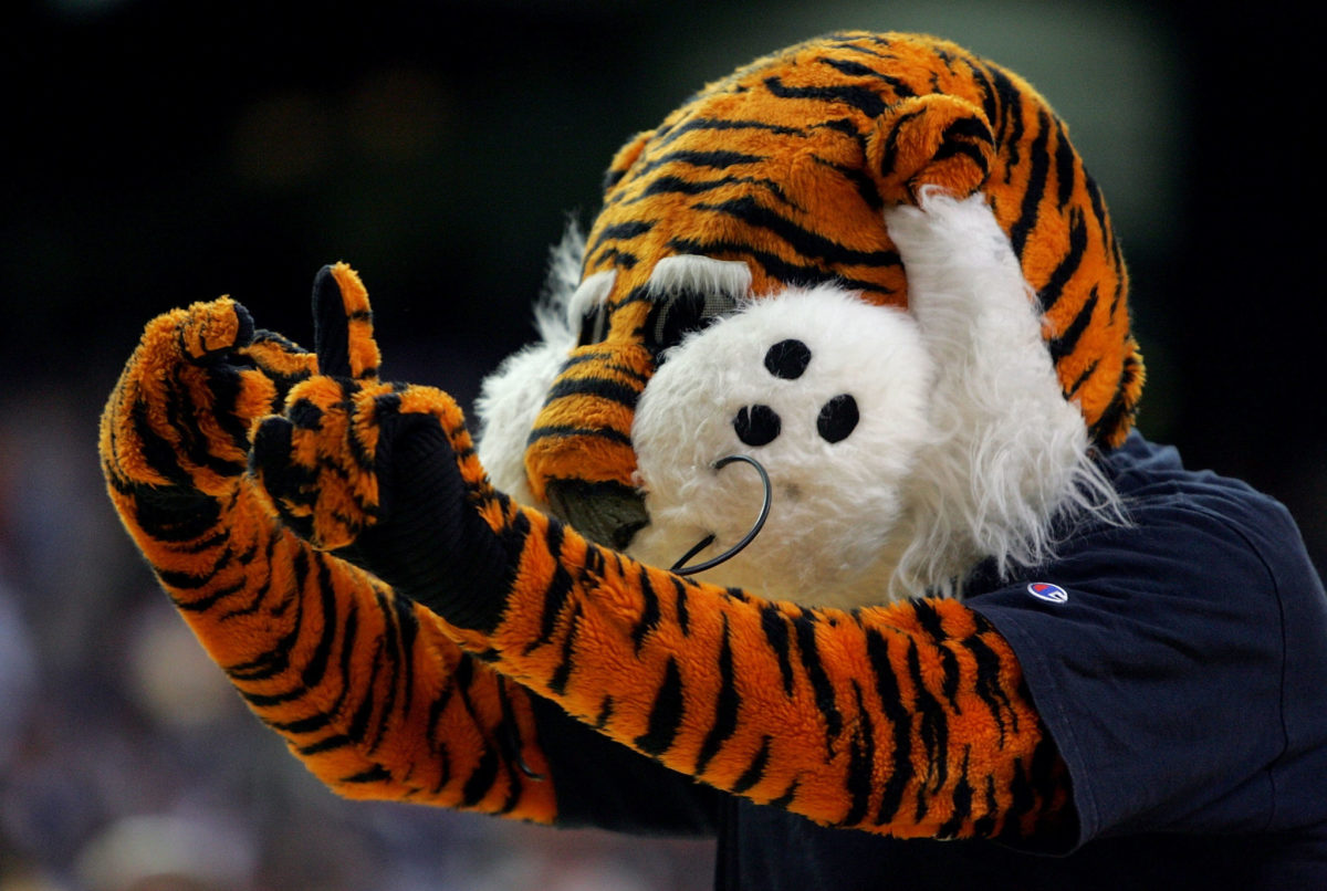 Aubie, the mascot for the Auburn Tigers cheers during a time out in the first round of the SEC Men's Basketball Tournament against the Vanderbilt Commodores at the Georgia Dome.