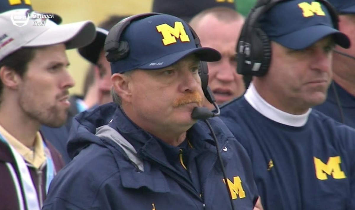 A Michigan coach with an orange mustache.