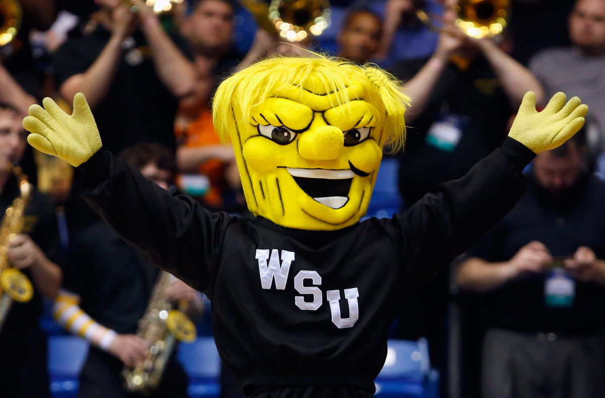 Wichita State's mascot raising his arms.