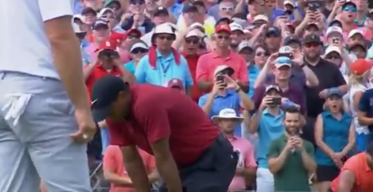 Tiger Woods shakes his head after missing a putt.