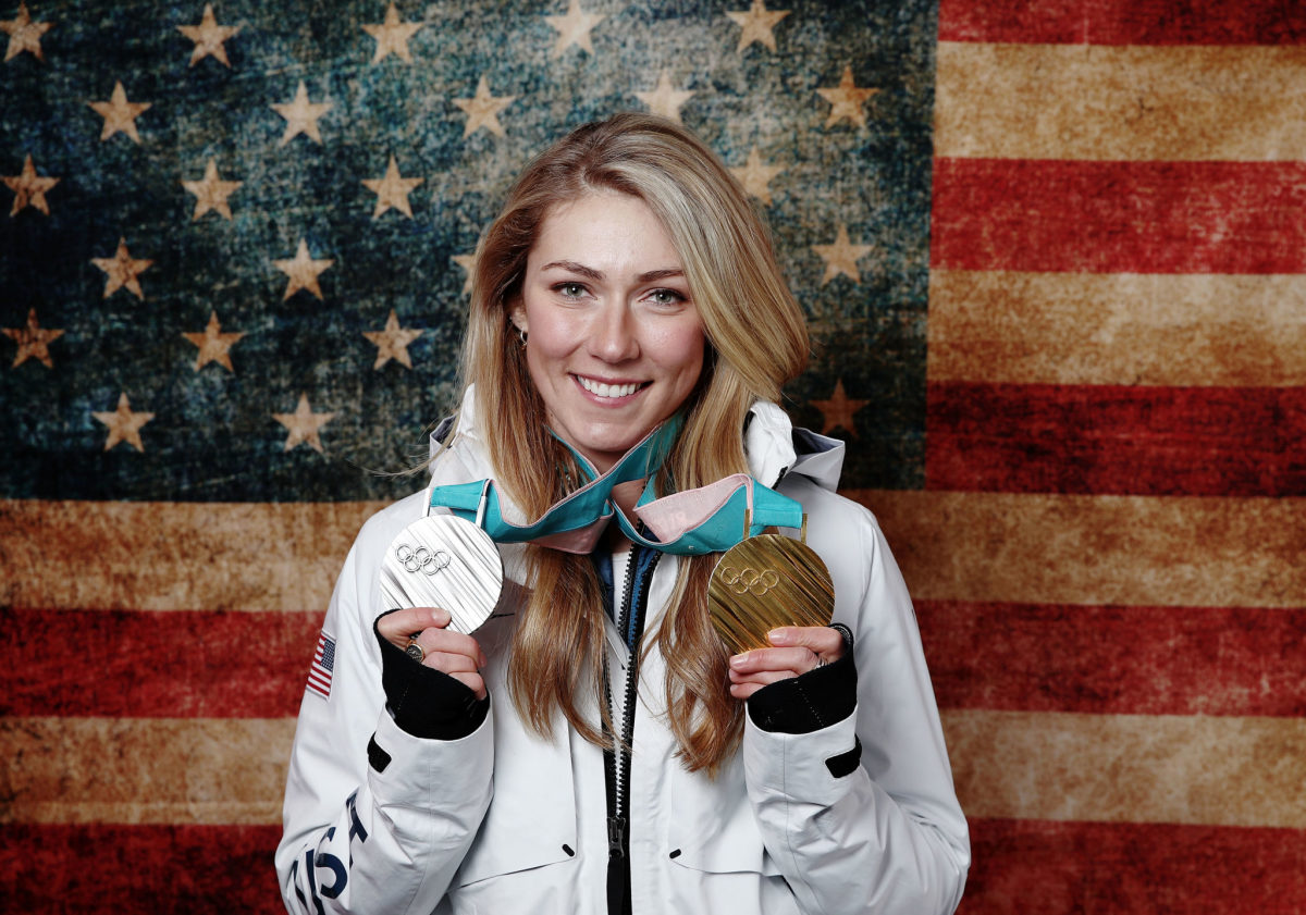Mikaela Shiffrin showing off her olympic medals.