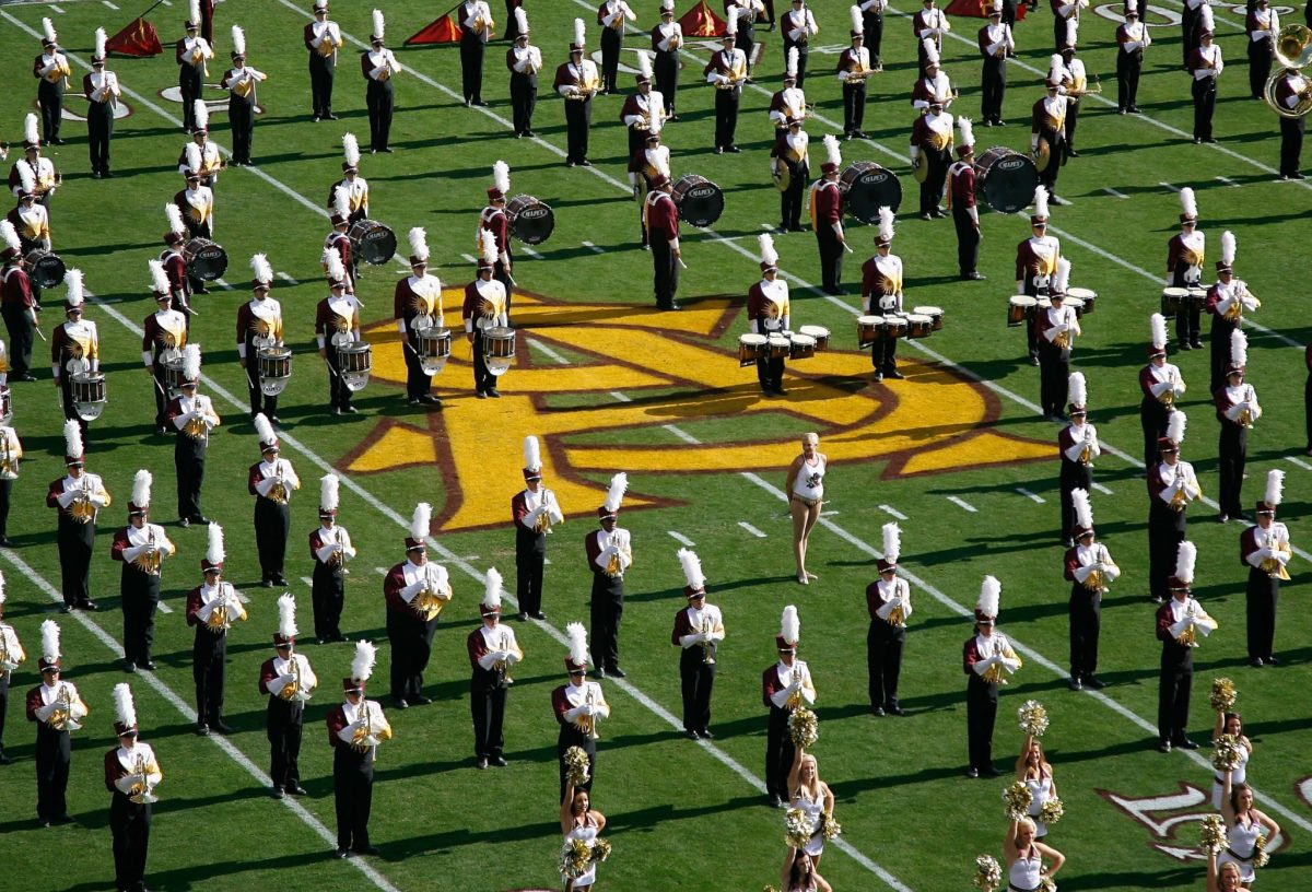The Arizona State Sun Devils marching band and cheerleaders perform before the college football game against the Arizona Wildcats at Sun Devil Stadium.