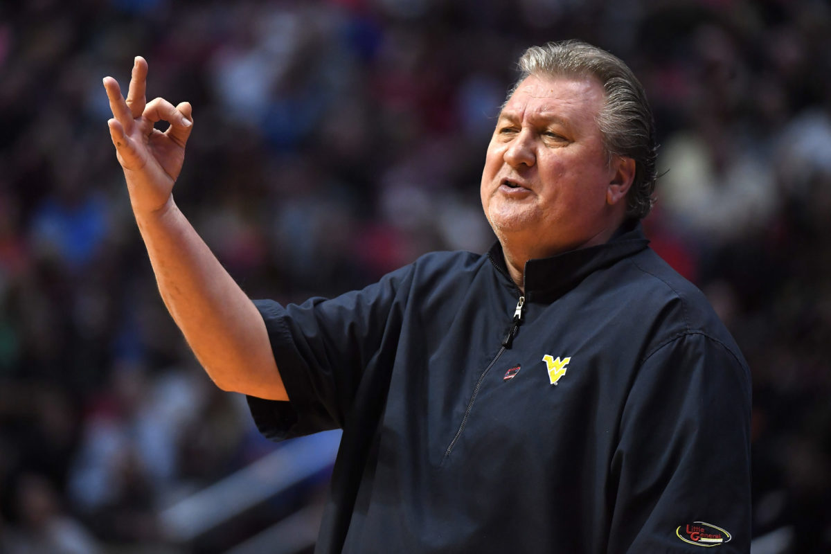 Bob Huggins making an "ok" sign with his fingers