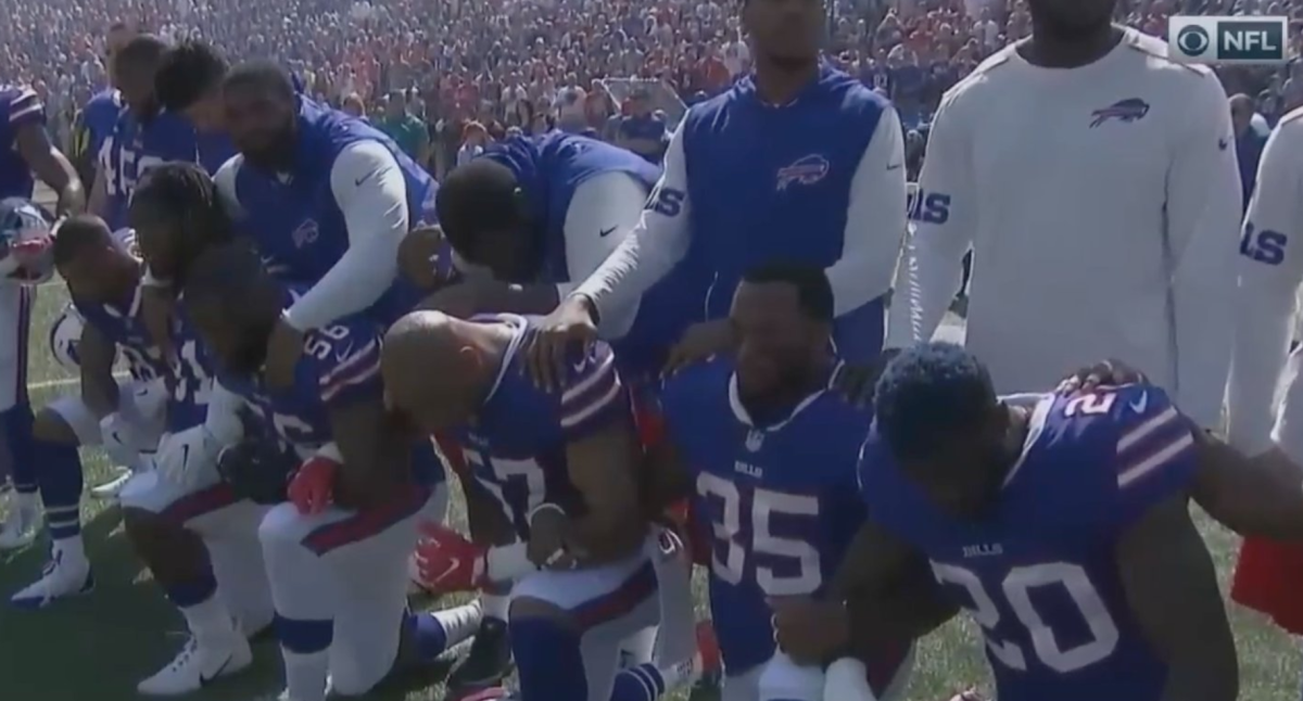 Buffalo Bills kneel during national anthem.