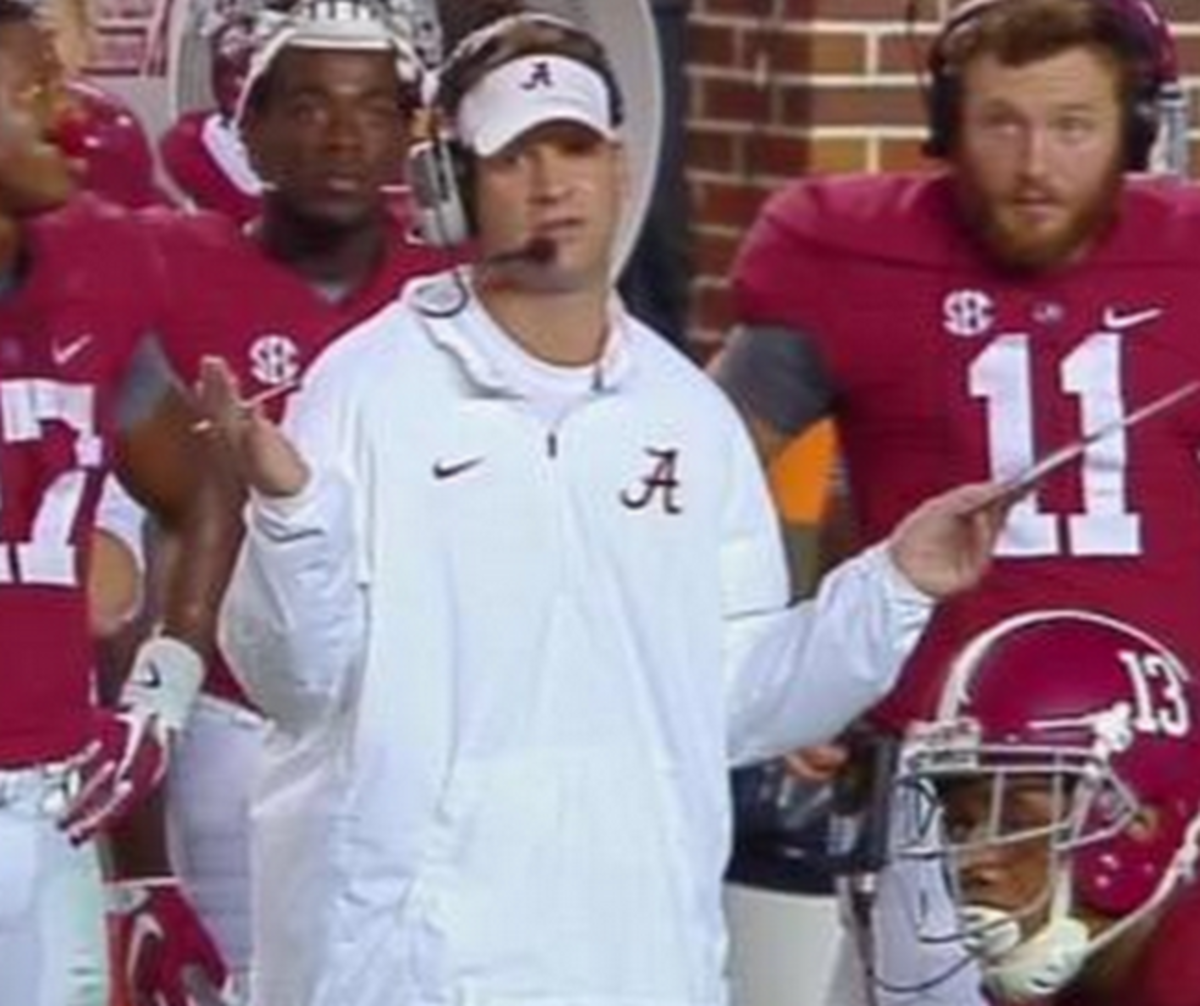 Lane Kiffin with his hands to his side for Alabama.
