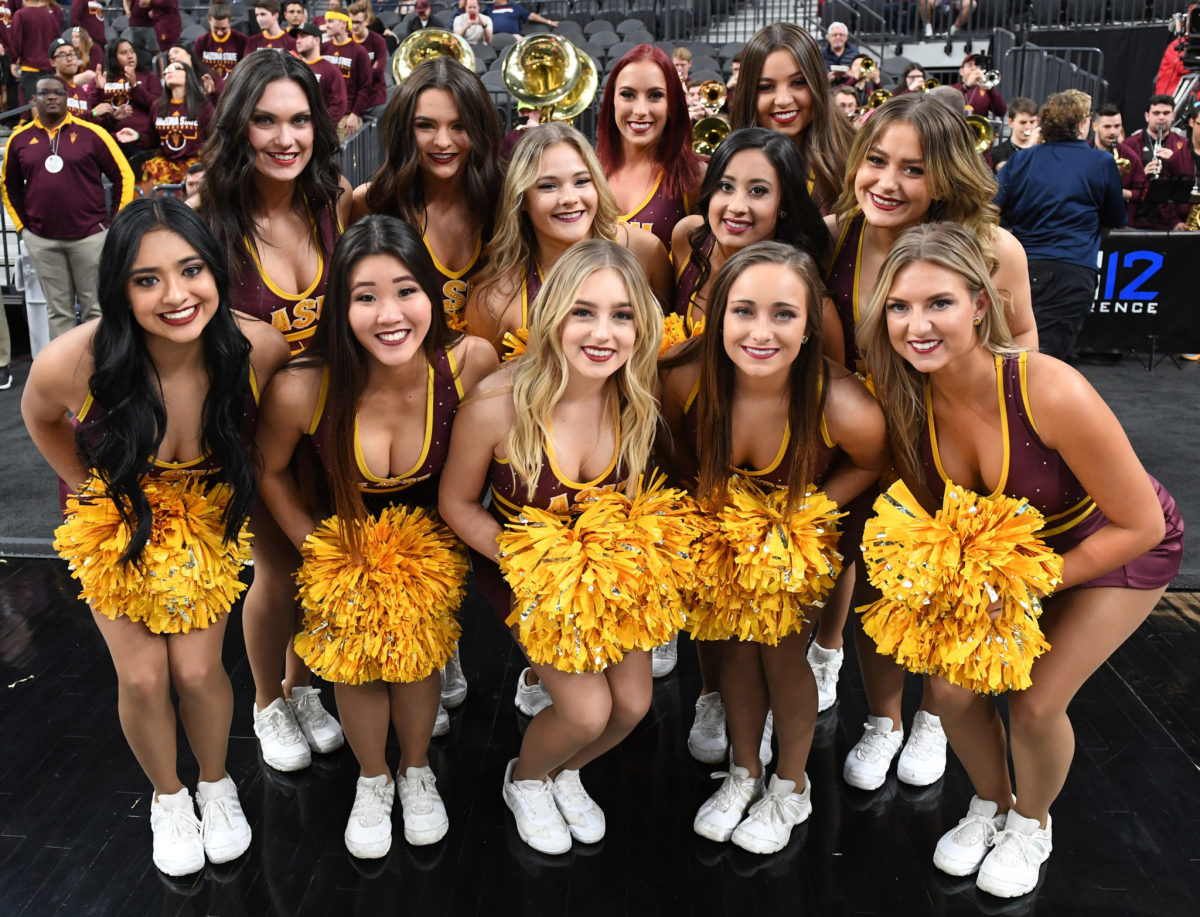 Arizona State Sun Devils cheerleaders pose before the team's first-round game of the Pac-12 basketball tournament against the Colorado Buffaloes at T-Mobile Arena.