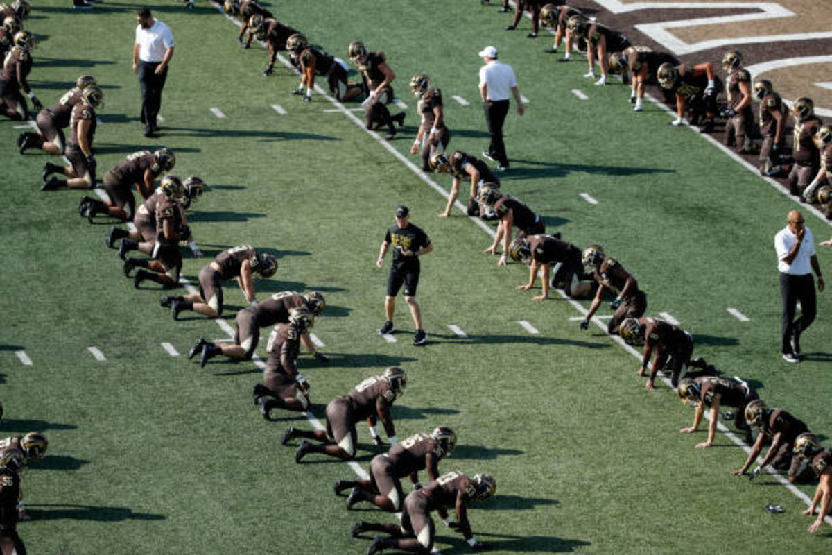 Western Michigan players warm-up before home game against Syracuse.