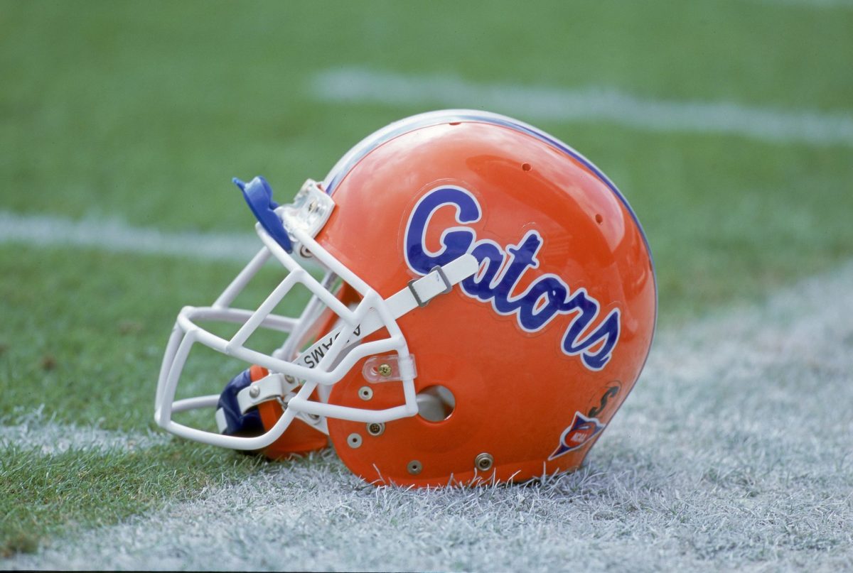 A Florida Gators helmet sitting on the field.