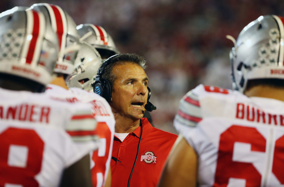 A closeup of Urban Meyer talking to his Ohio State football players.