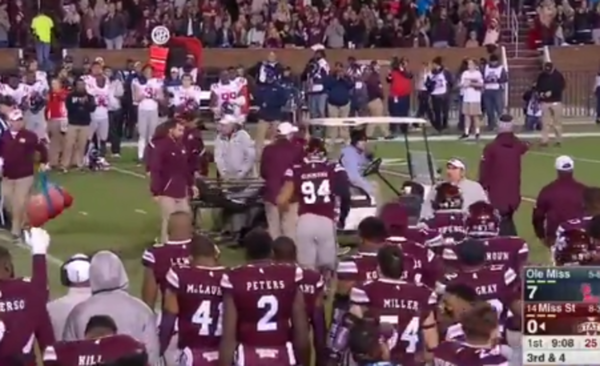 Nick Fitzgerald is carted off during Egg Bowl.