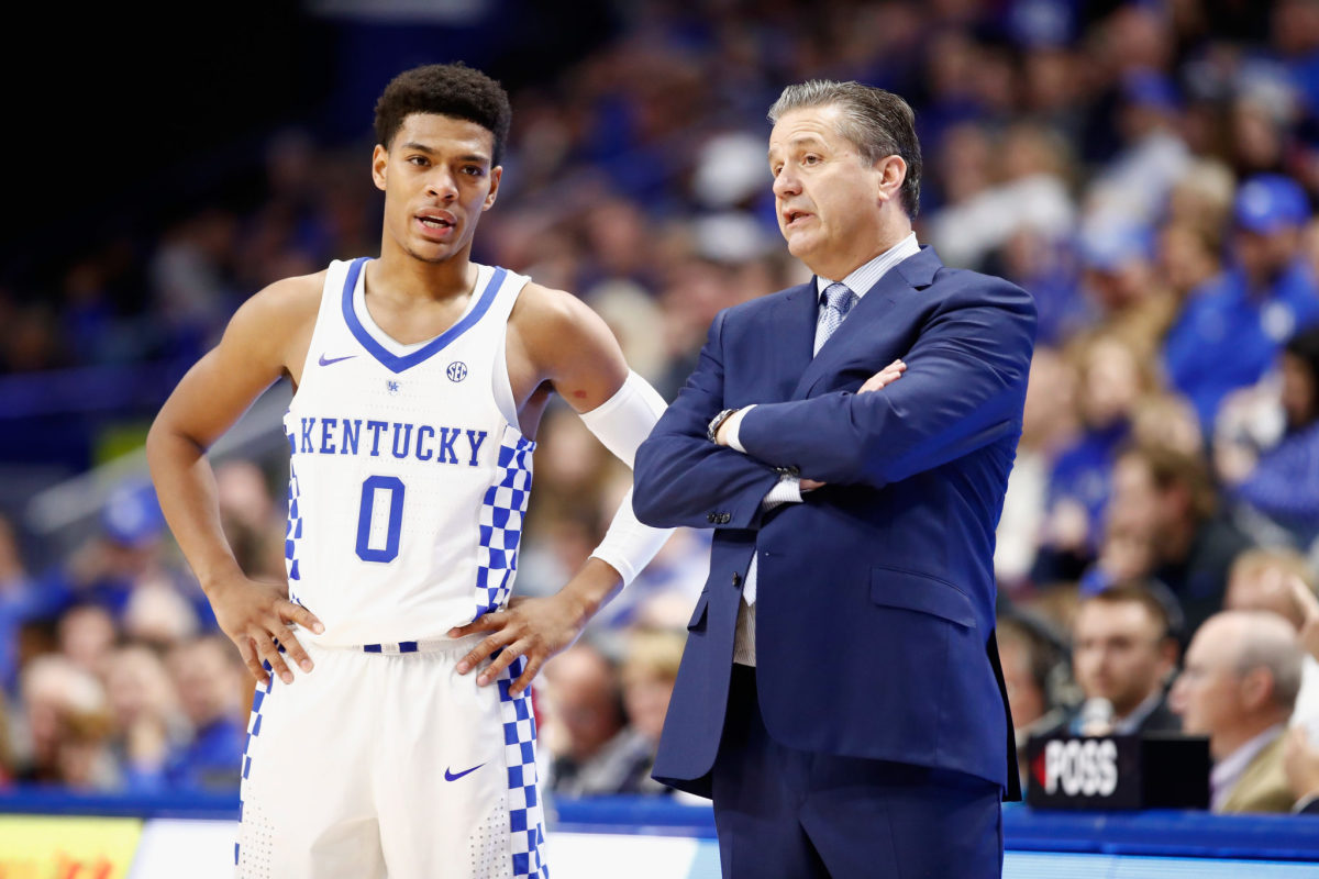 Coach Cal standing with Quade Green on the Kentucky sideline.