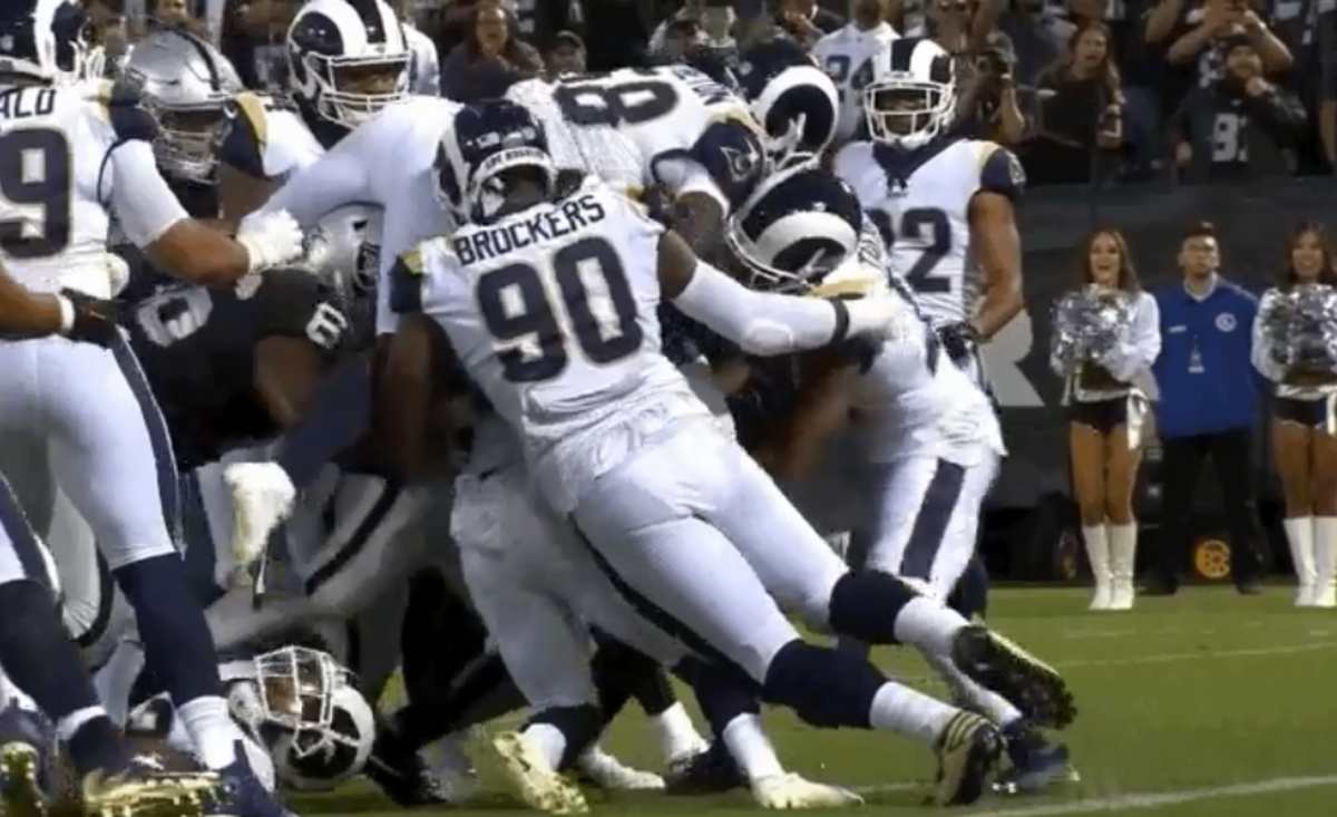 Marshawn Lynch dragging players into the end zone.