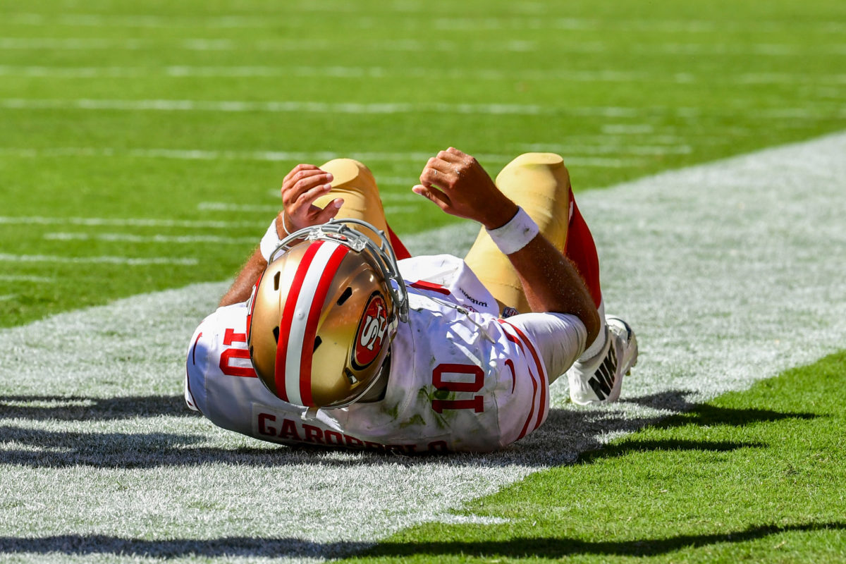 Jimmy Garoppolo lies down after being hurt.