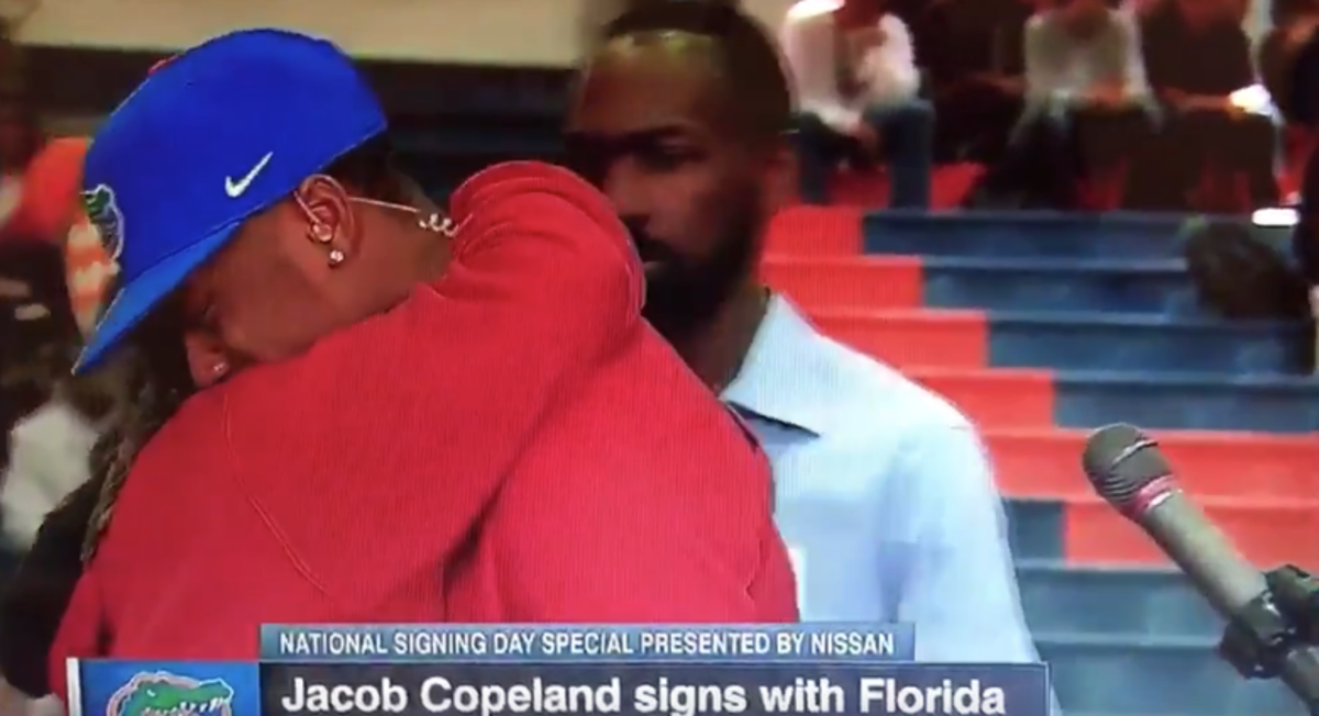 Florida commit Jacob Copeland hugs his mom.