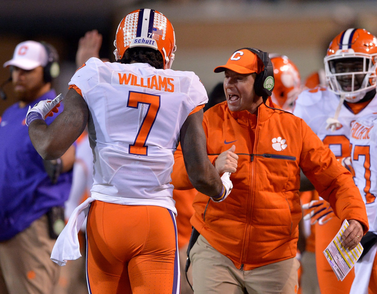 Mike Williams celebrates with head coach Dabo Swinney of the Clemson Tigers.