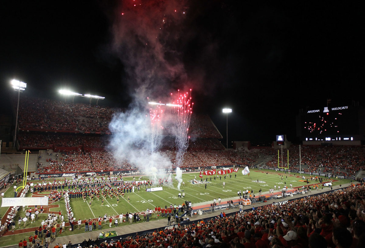 Fireworks explode as the Arizona football team takes the field.