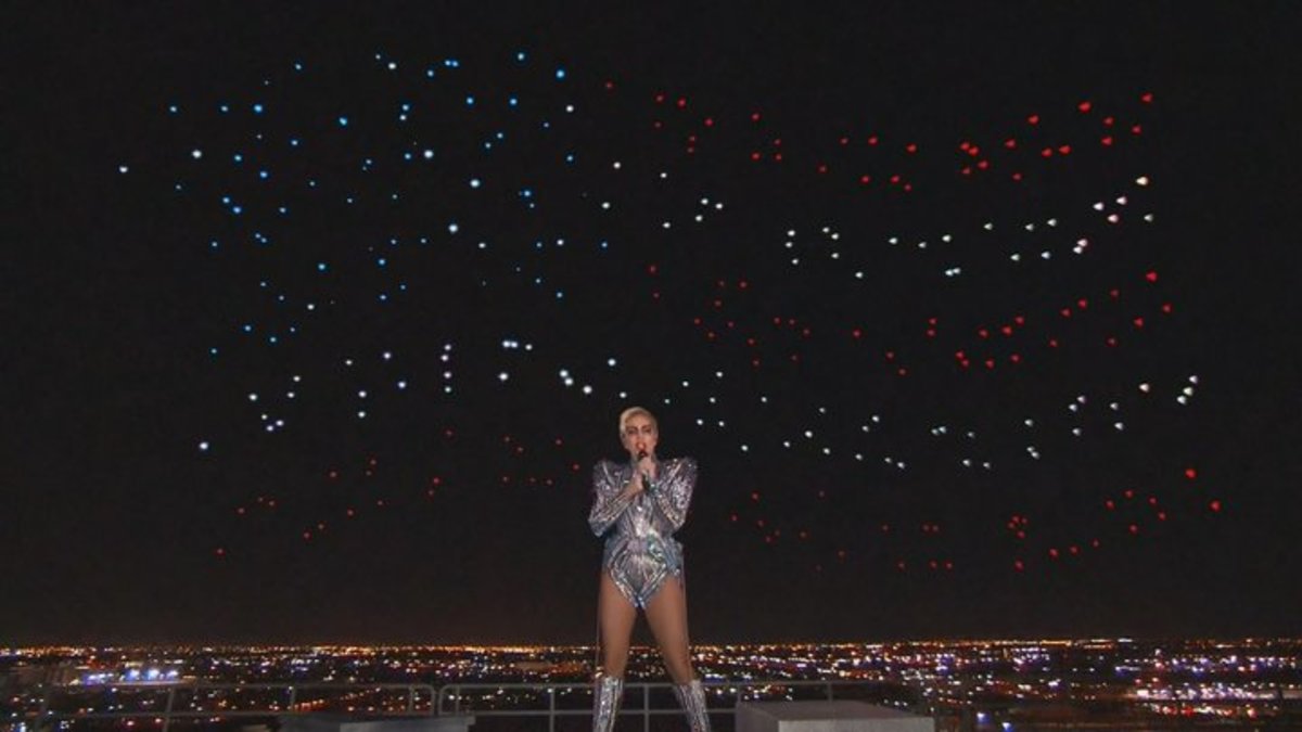 Lady Gaga sings in her metallic dress during the Super Bowl.