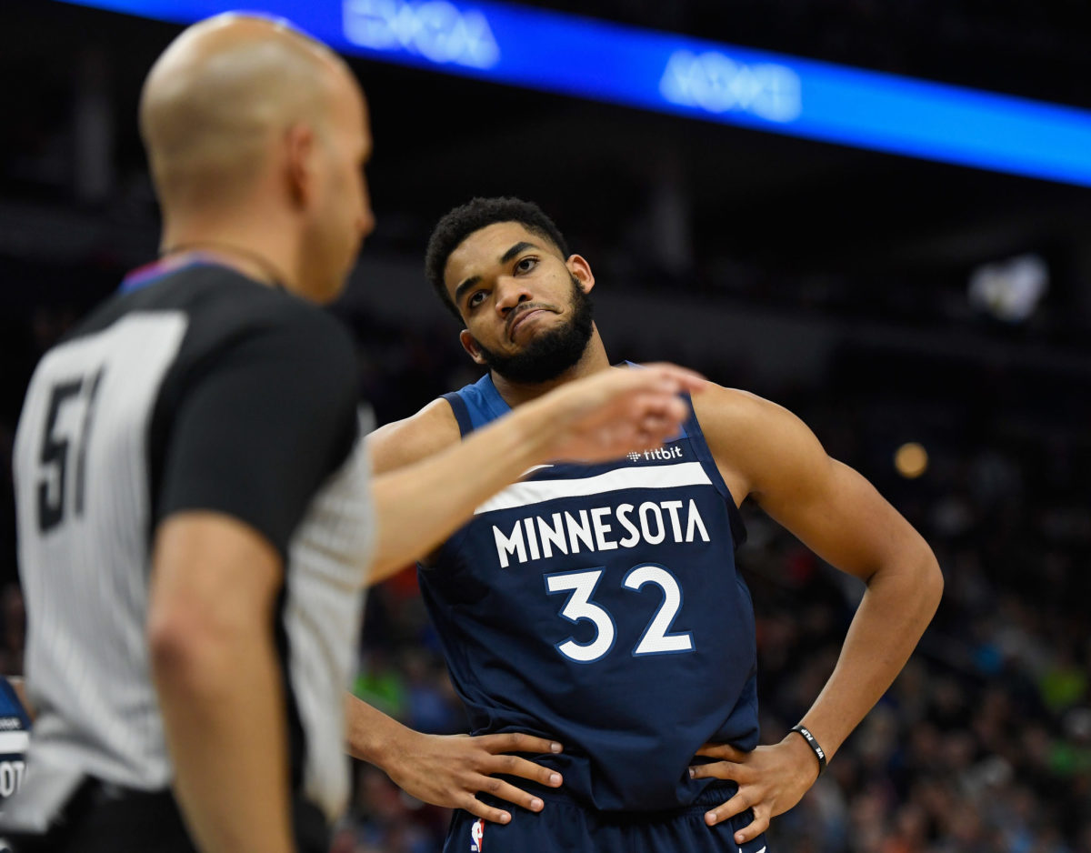 Karl-Anthony Towns frowns at an official.