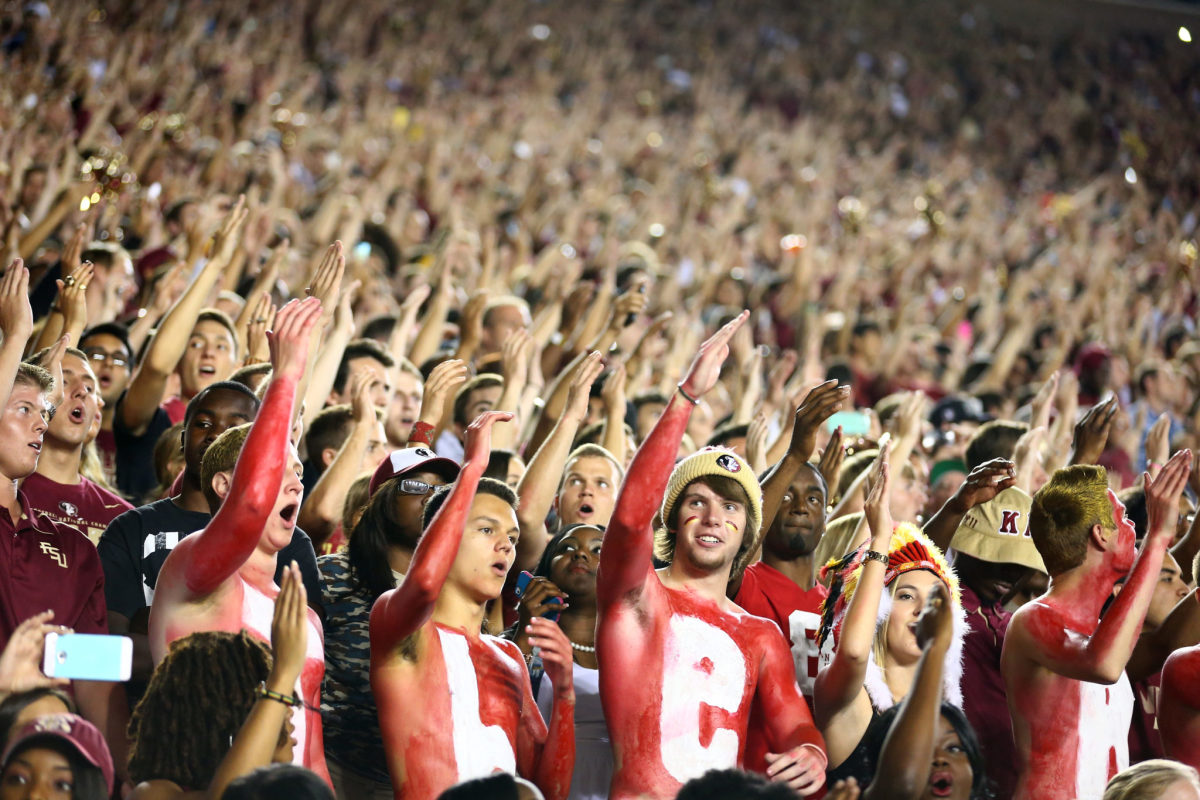 Florida State fans cheering during a football game.