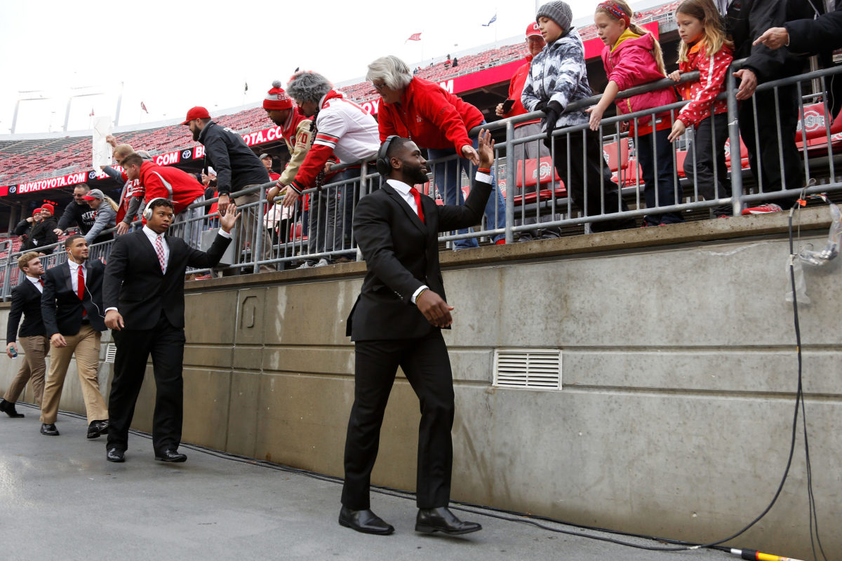 J.T. Barrett and the Ohio State football team interacting with the fans.