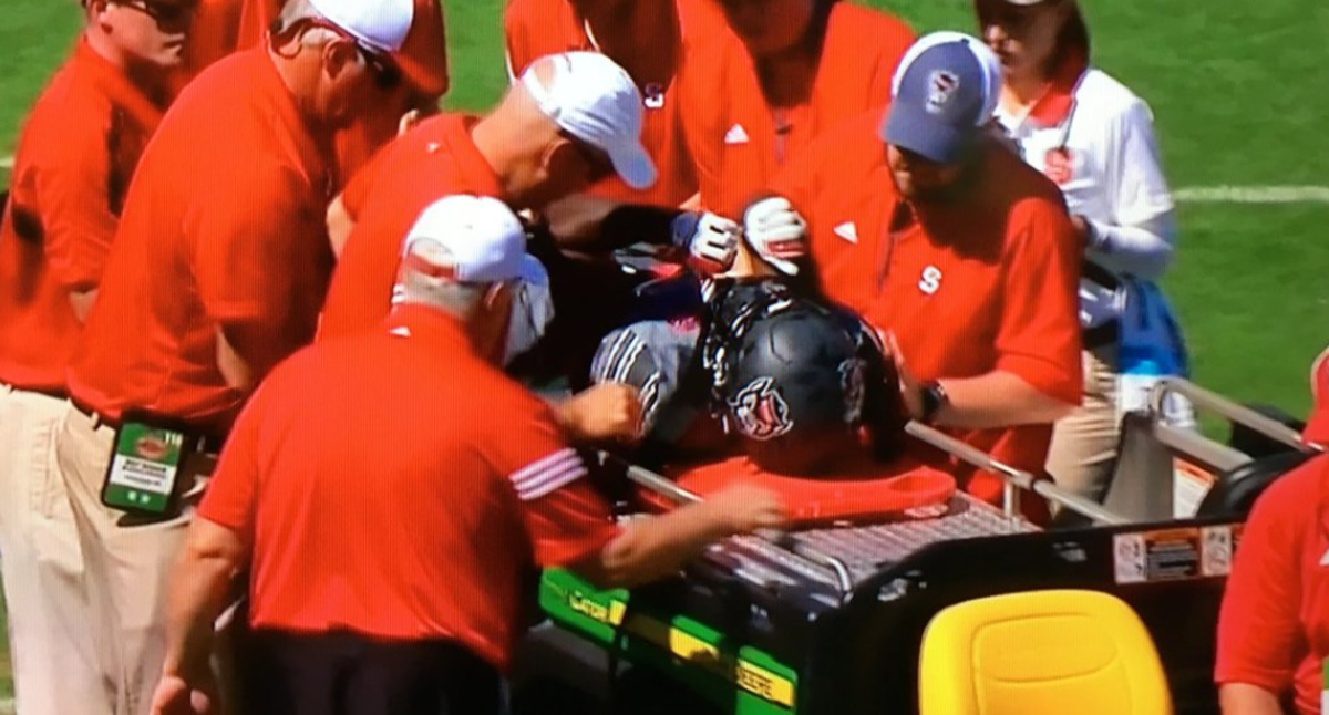 NC State's Darkwa Nichols is carted off field after injury vs. Syracuse.