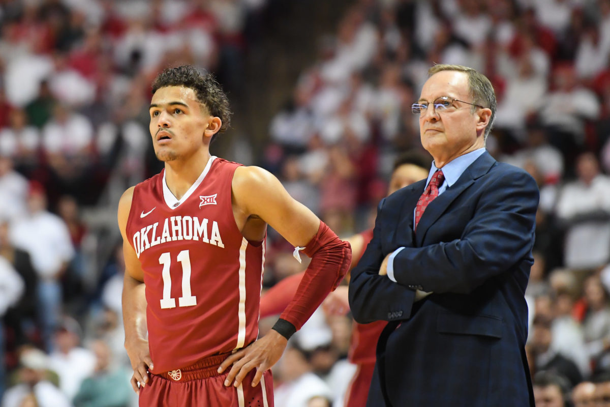 Trae Young standing next to Oklahoma coach Lon Kruger