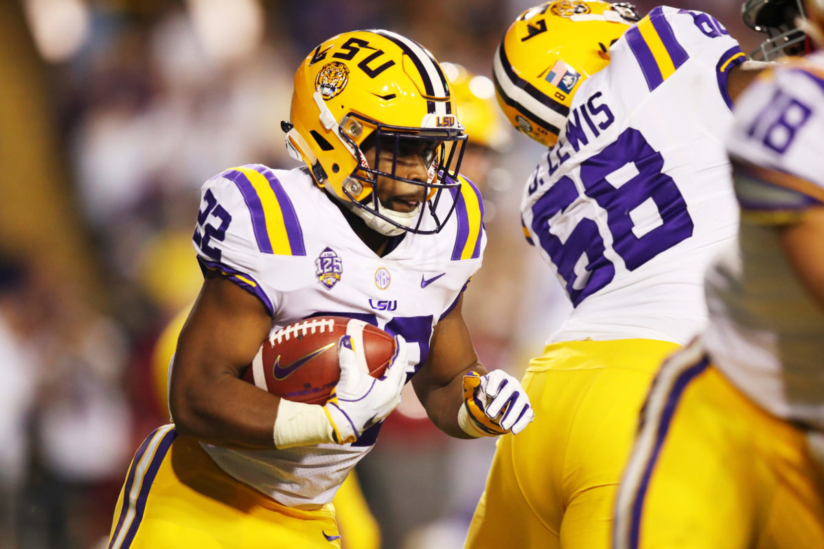 Kristian Fulton of LSU attempts to run the ball against Alabama.
