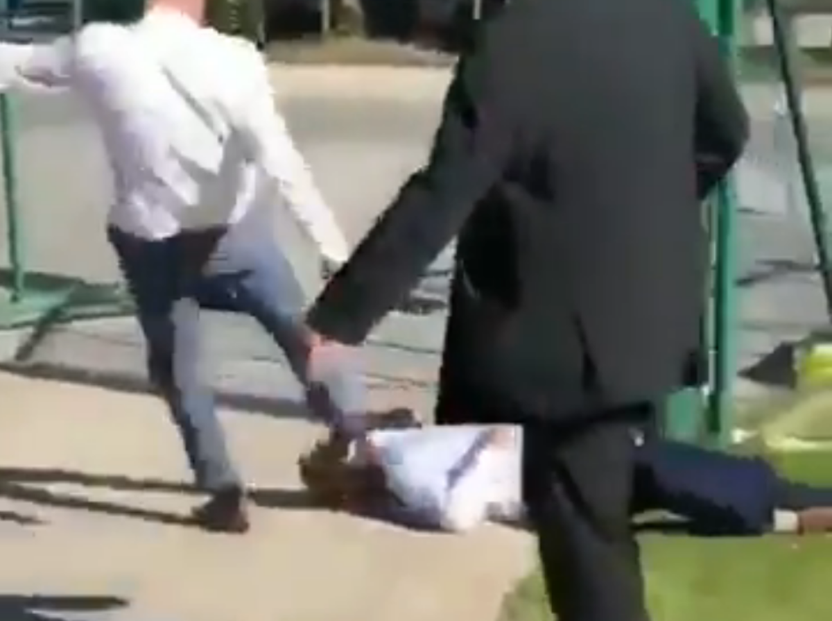 Man gets kicked in the head during fight at horse track.