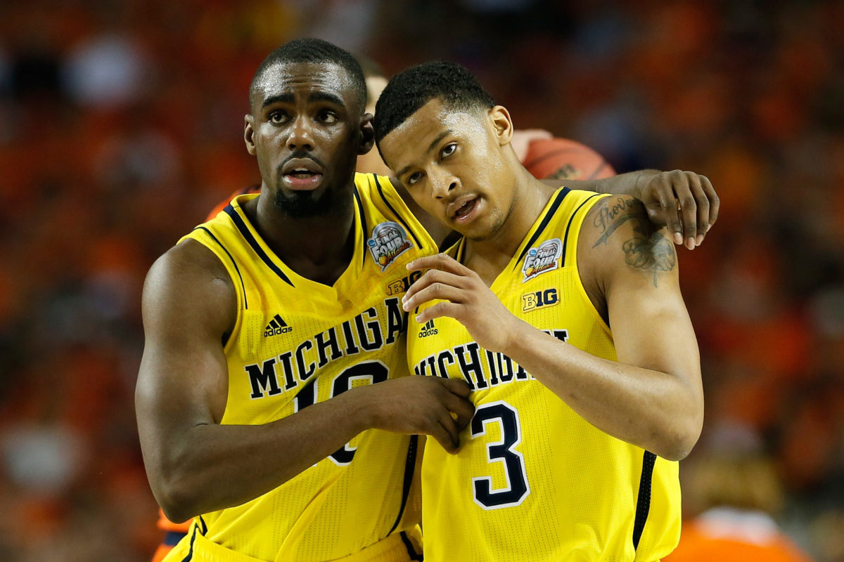 Tim Hardaway Jr. #and Trey Burke of the Michigan Wolverines react in the second half against the Syracuse Orange.