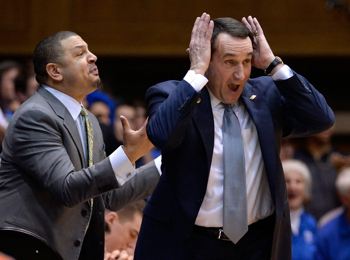 Coach K and Jeff Capel react to a call.