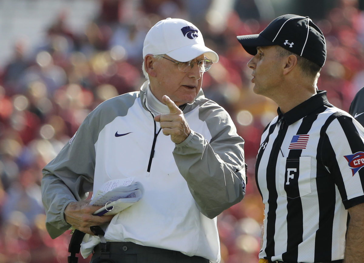 Bill Snyder talks with an official.