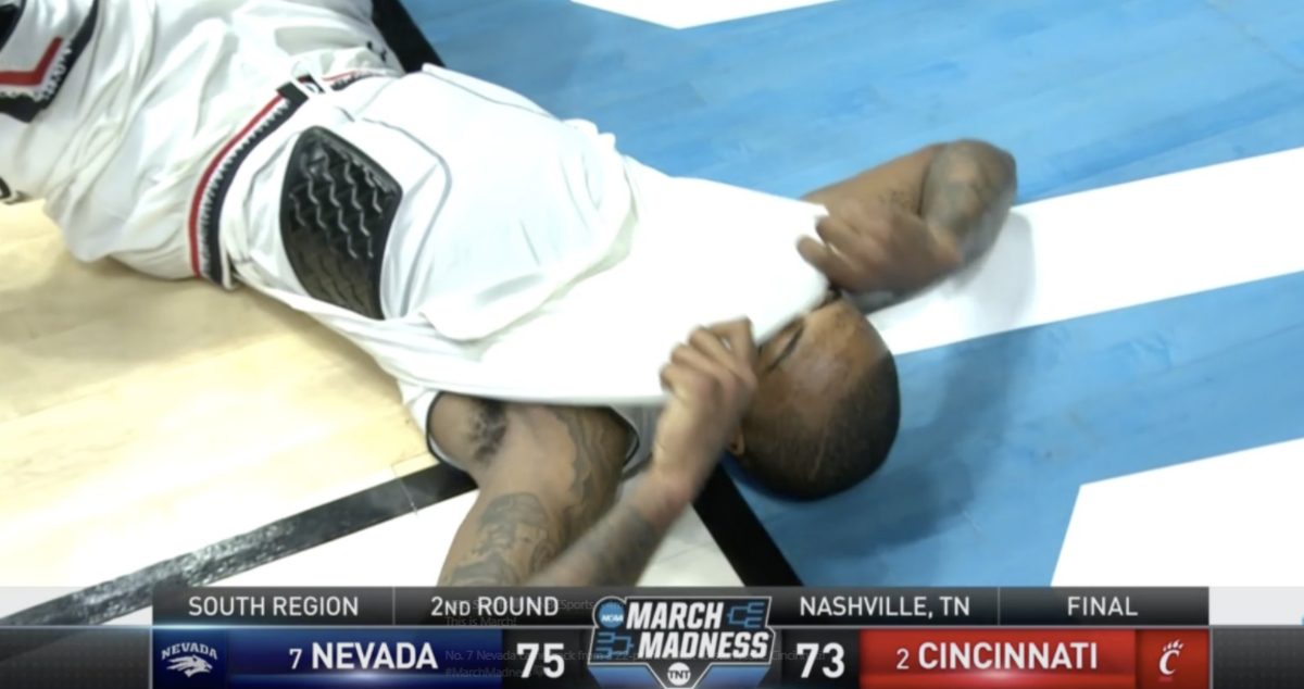 Cincinnati player lies on the floor in disbelief.