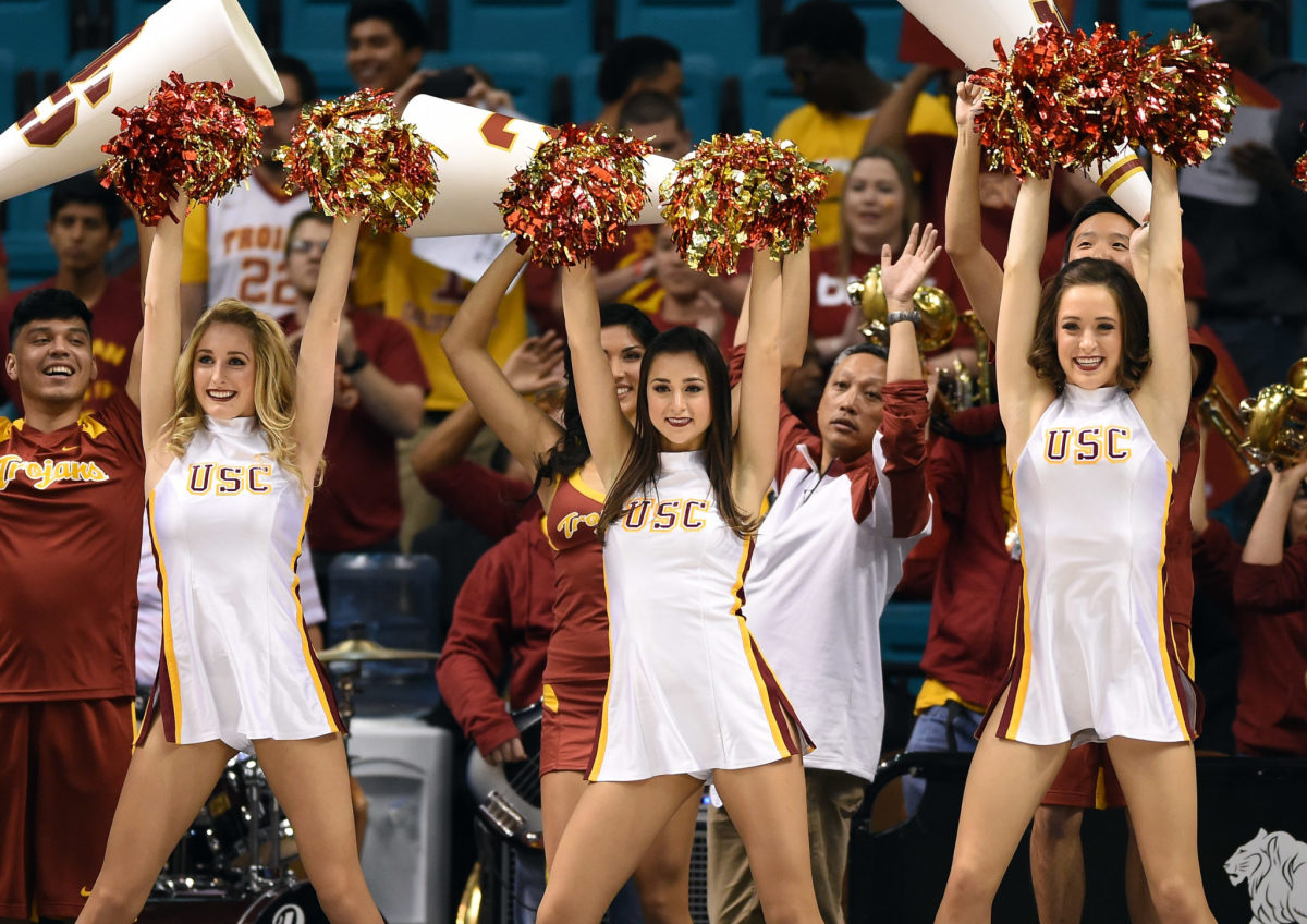 USC Trojans cheerleaders perform during a first-round game of the Pac-12 Basketball Tournament against the Arizona State Sun Devils at the MGM Grand Garden Arena.