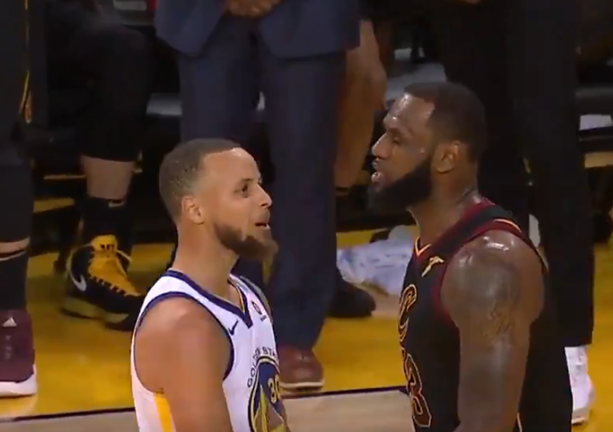 LeBron James and Steph Curry chat after blocked shot.