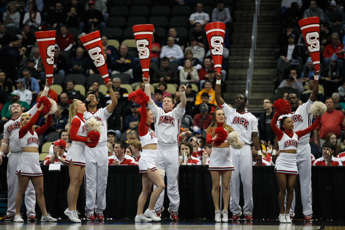 NC State's cheerleading squad during a basketball game.