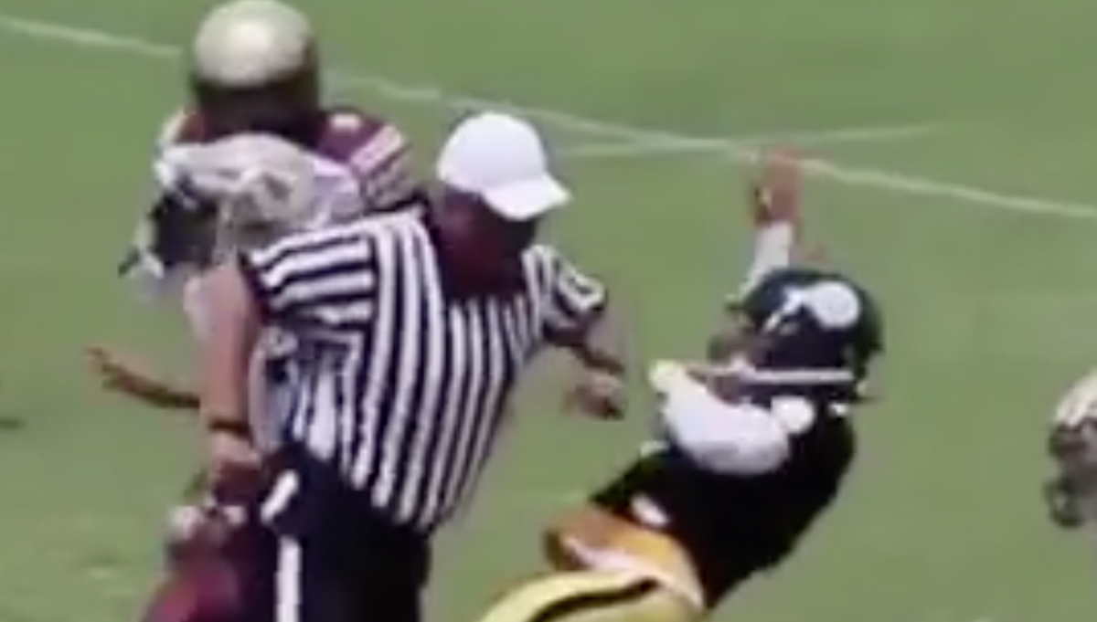 referee lays out qb during youth game