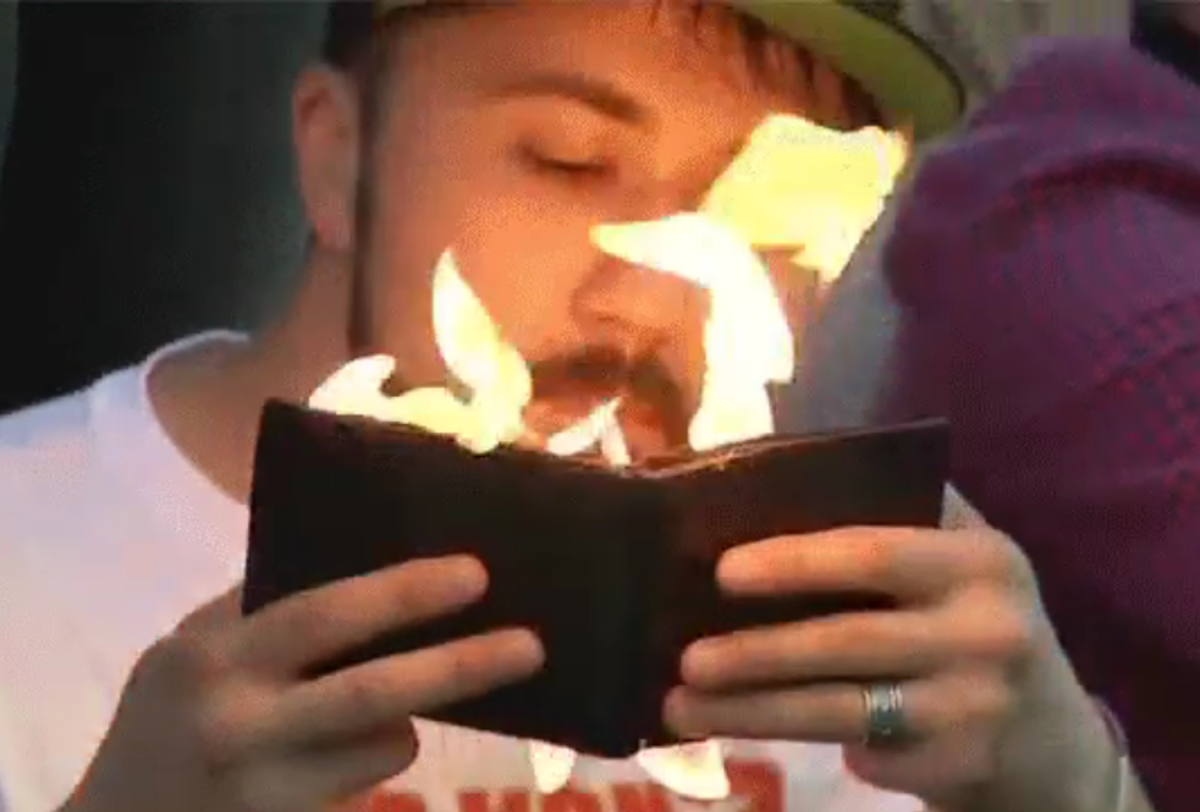 World cup fan lights cigarette with crazy large flame.