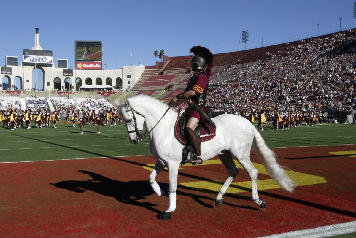 USC's mascot riding on a white horse in the end zone.