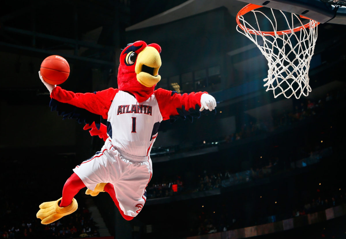 Harry the Hawk, mascot of the Atlanta Hawks, dunks during a timeout in the game between the Atlanta Hawks and the Brooklyn Nets at Philips Arena.