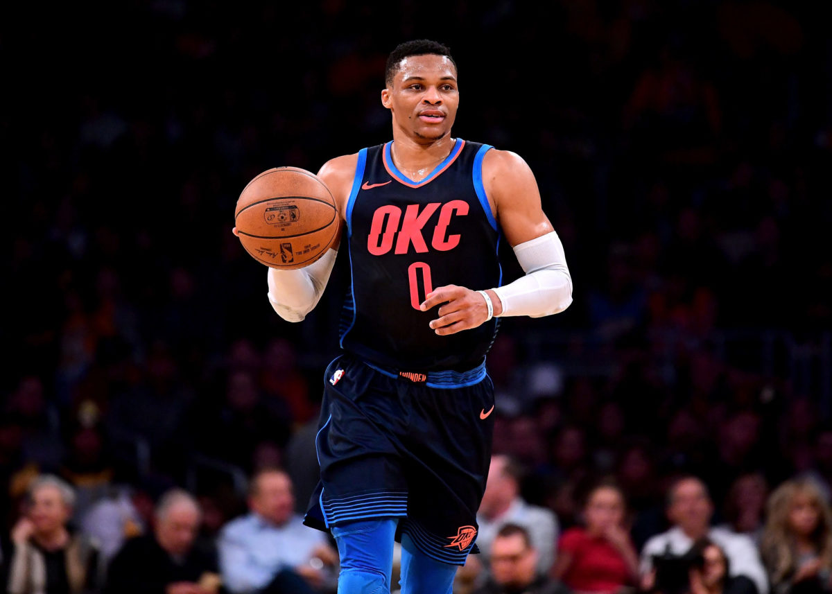 Russell Westbrook dribbling up the court in his alternate Oklahoma City Thunder uniform.