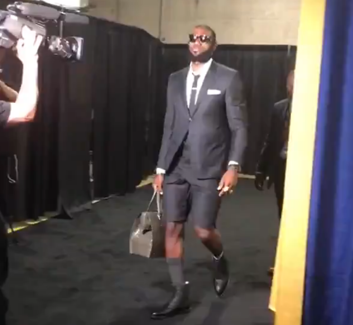 LeBron James wearing shorts with a suit.