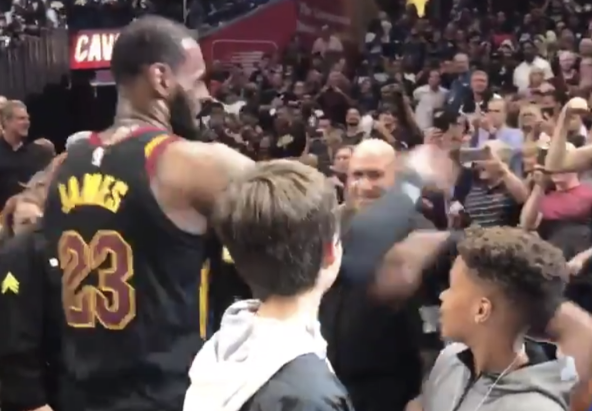lebron greets his kids after hitting the game-winner