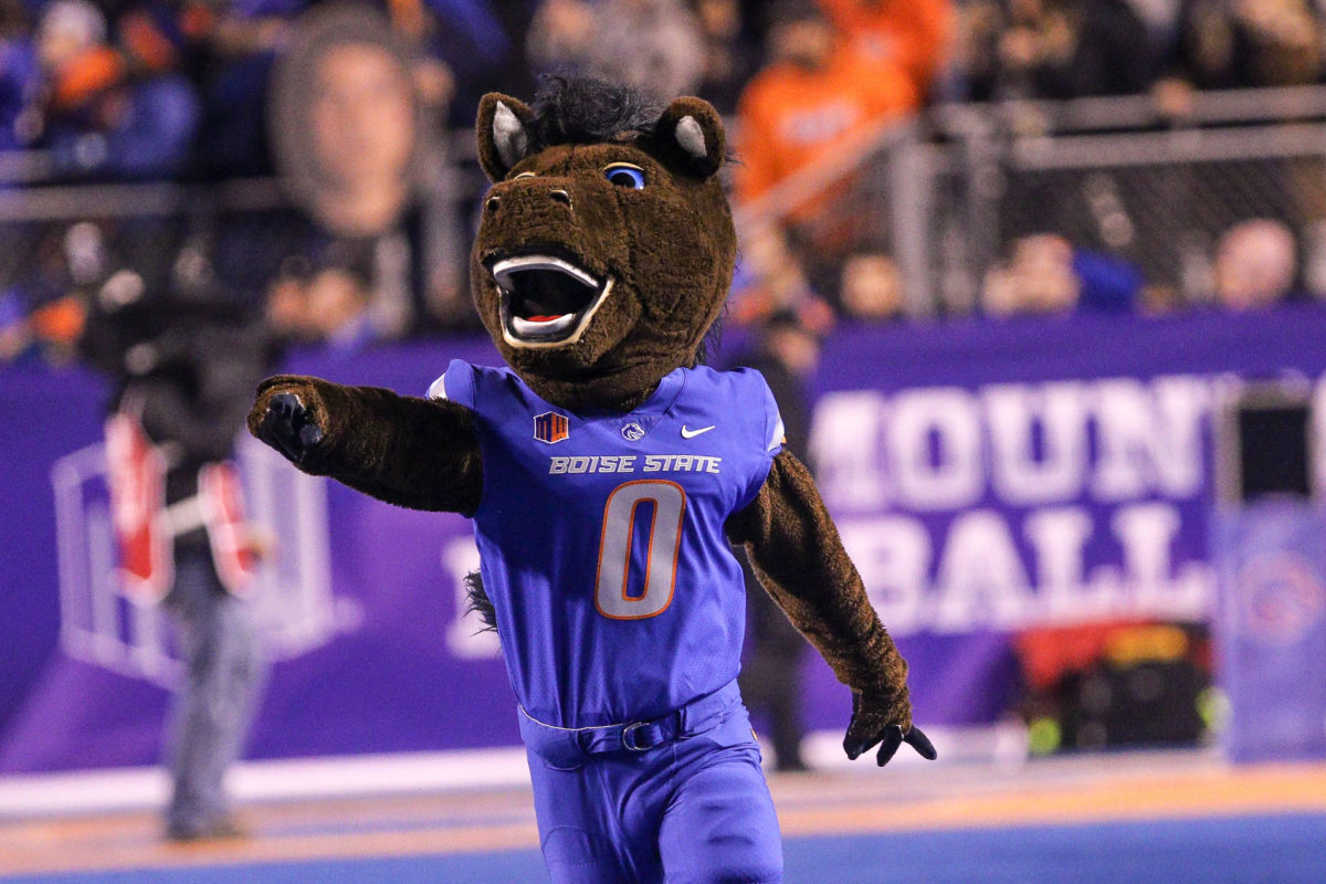 Boise State's mascot raising its arm.