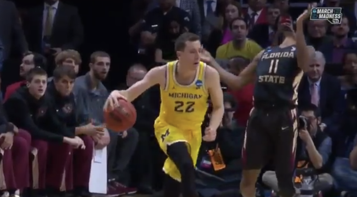 Michigan's Duncan Robinson was called for a flagrant foul on this play.
