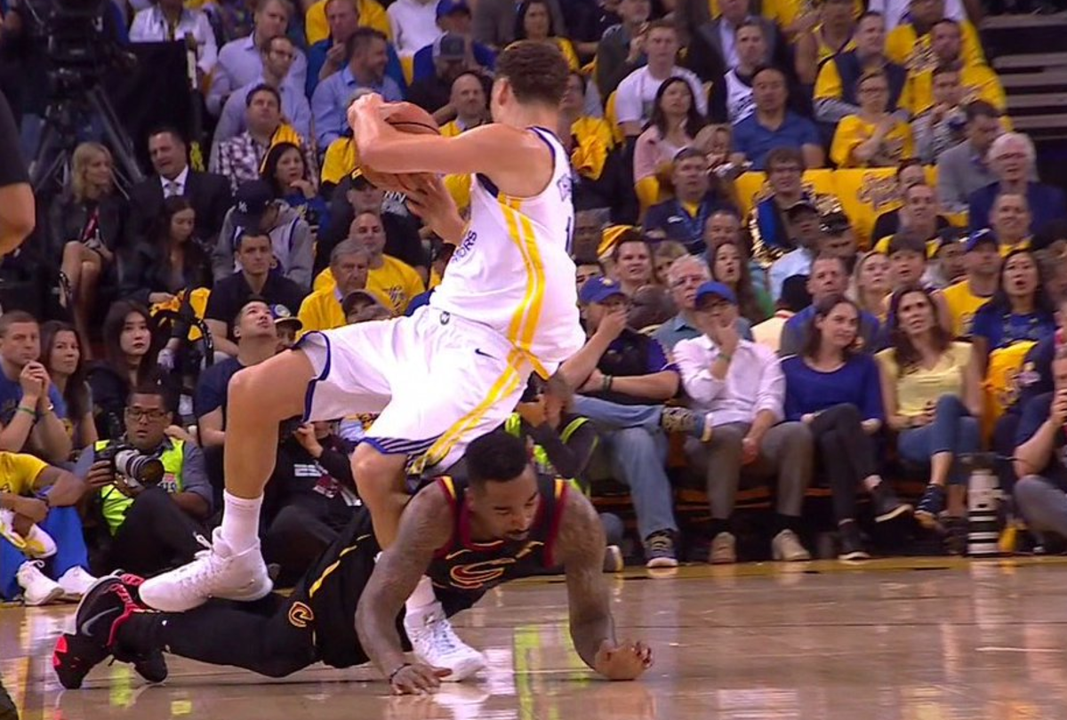 J.R. Smith diving into Klay Thompson's legs