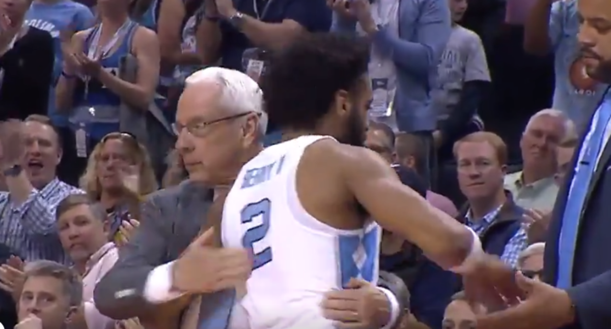 Roy Williams hugs Joel Berry in the final moments of NCAA Tournament loss to Texas A&M.